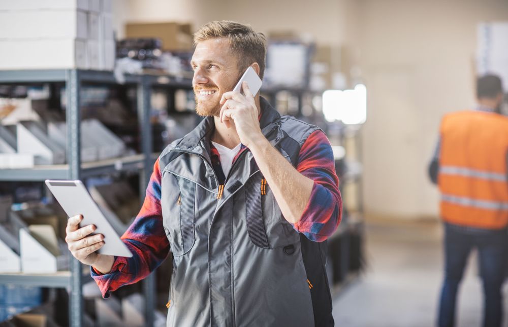 distribution-warehouse-worker-man-tablet-getty-994784078.jpg