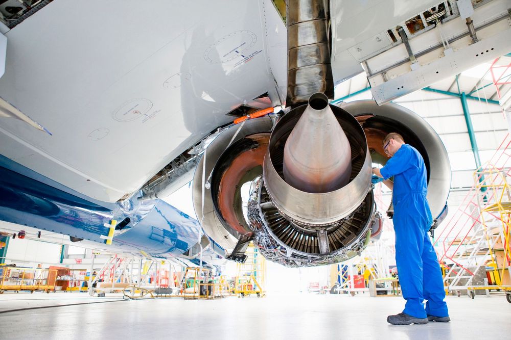 engineer-working-wings-of-passenger-jet-hangar-getty-482175029-150DPI.jpg