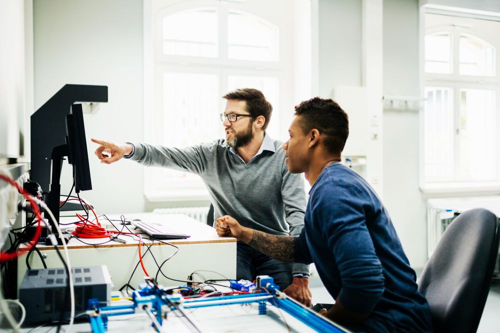 engineers-pointing-at-monitor-getty-872026300.jpg